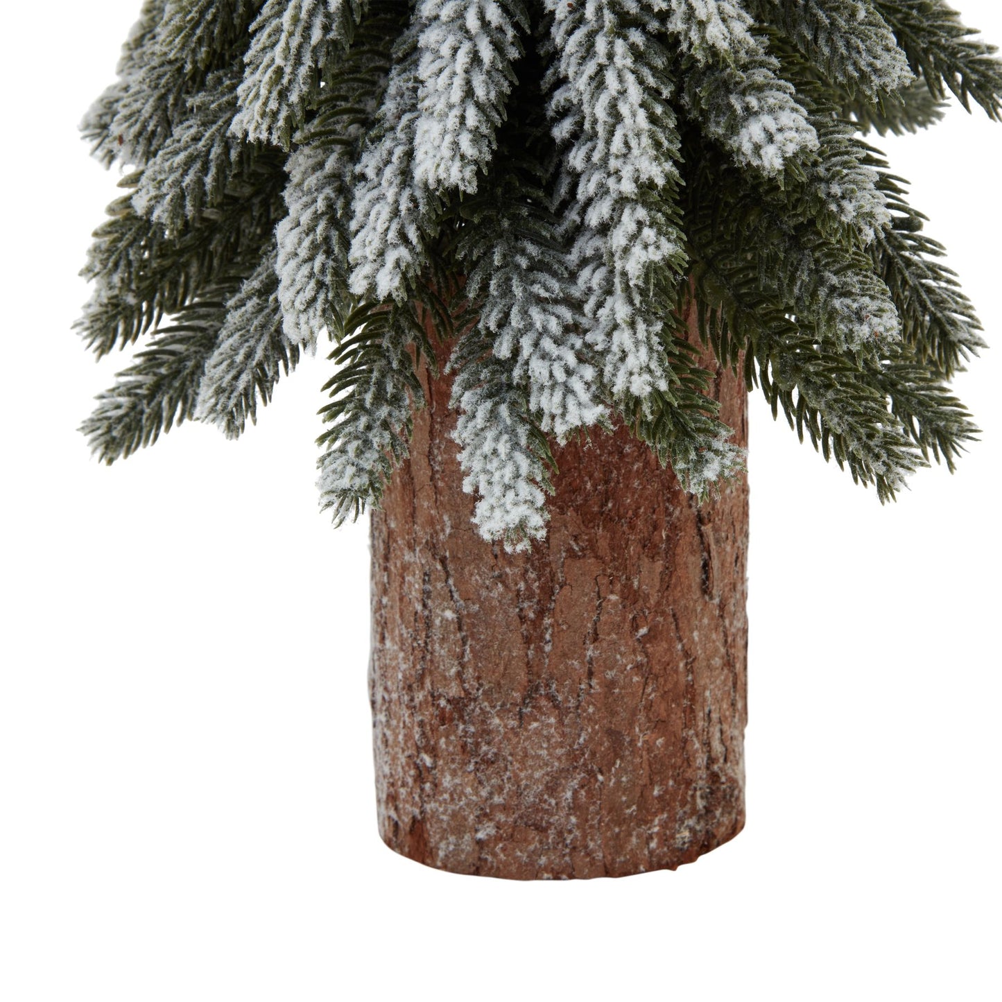 Small Snowy Spruce Tree On Tall Wood Log