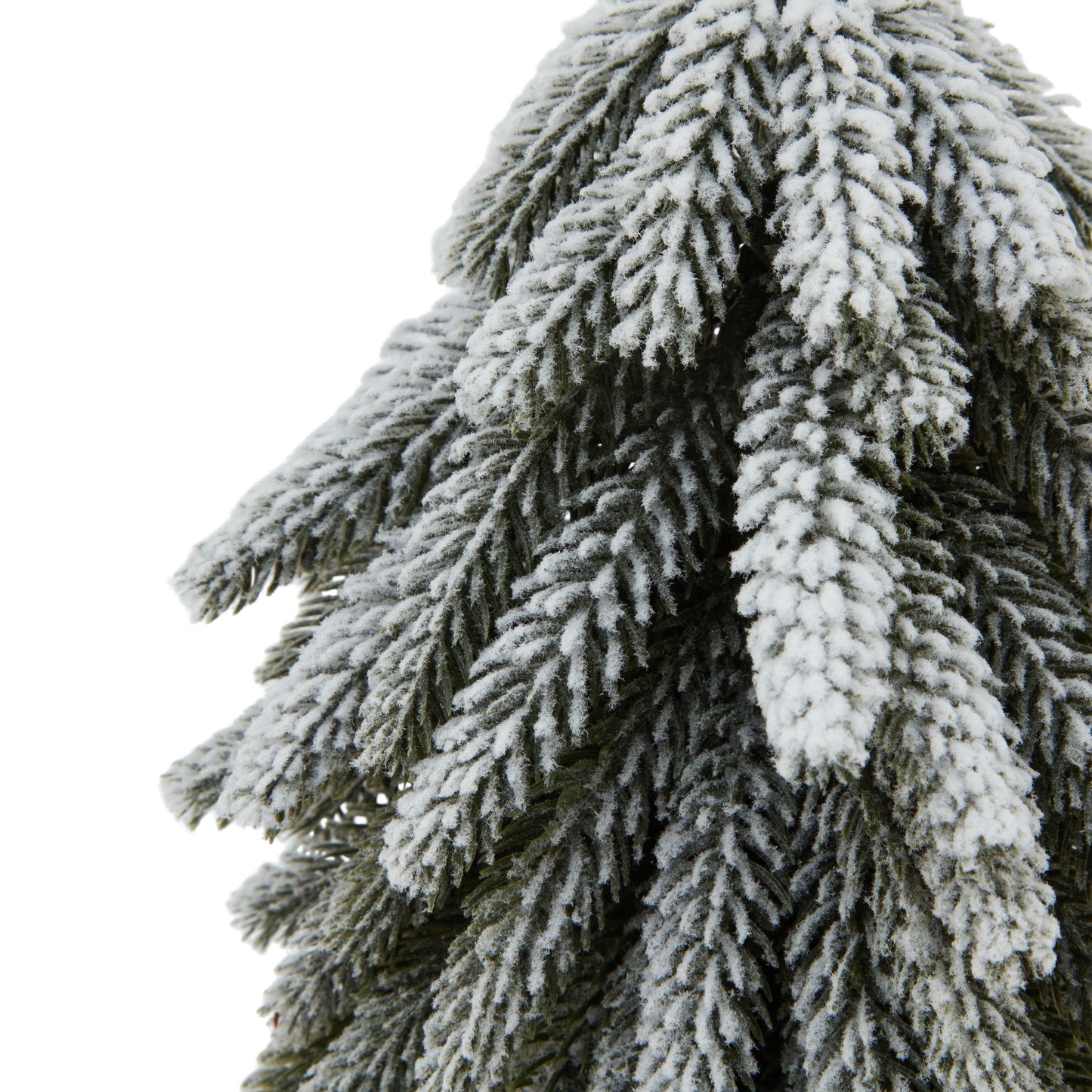 Small Snowy Spruce Tree On Tall Wood Log